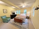 Detached guest house has a queen bed, smart TV, and full bathroom